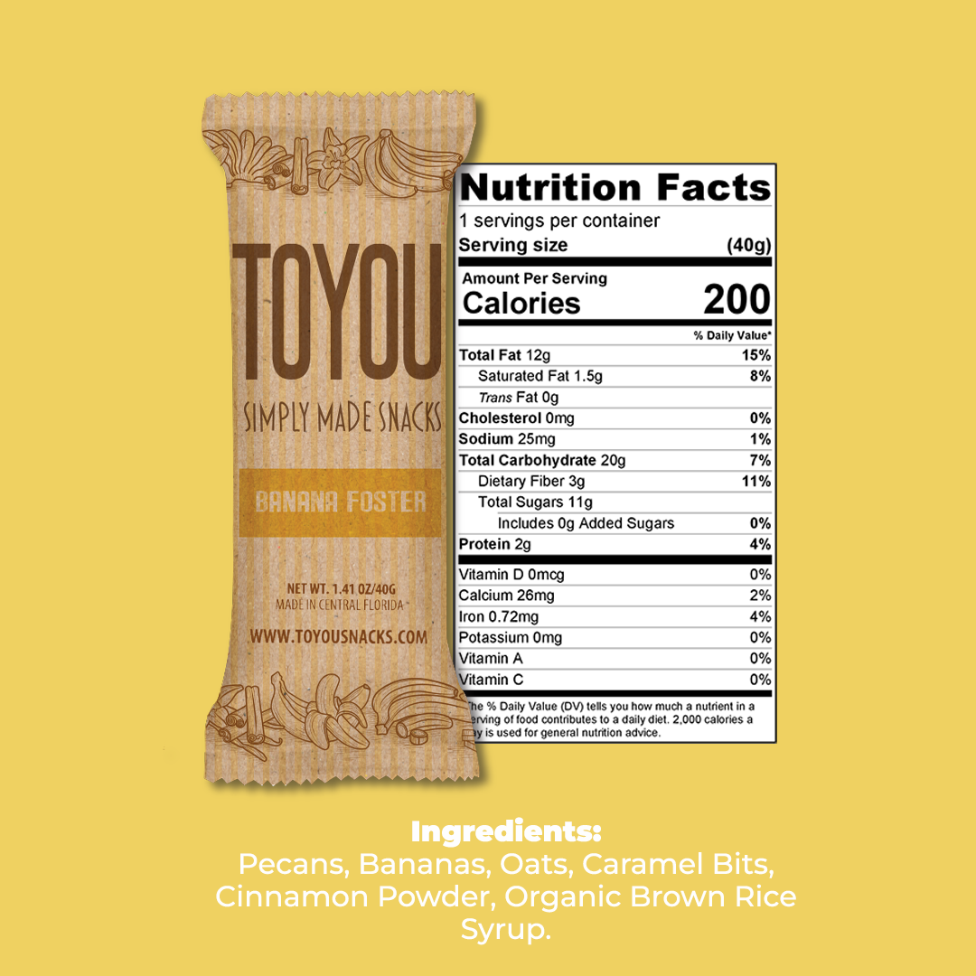 Front view: Banana Foster ToYou Snack bar in artistic paper wrapper next to the snack bar’s nutrition facts, above the Snack bar’s ingredients on a yellow background.