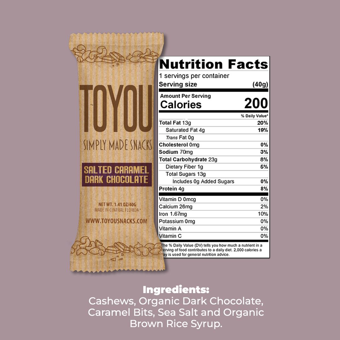 Front view: Salted Caramel Dark Chocolate ToYou Snack bar in artistic paper wrapper next to the snack bar’s nutrition facts, above the Snack bar’s ingredients on a light purple background.